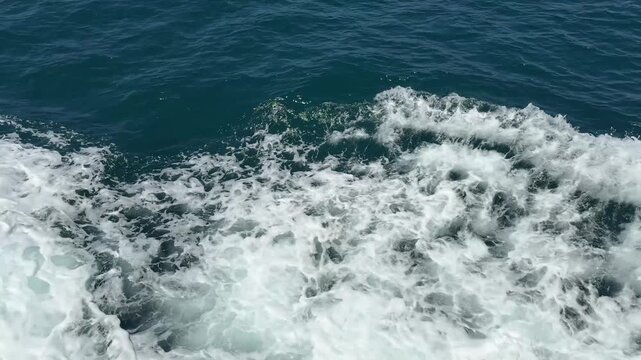 Ocean waves crashing against the shore in a filmstrip