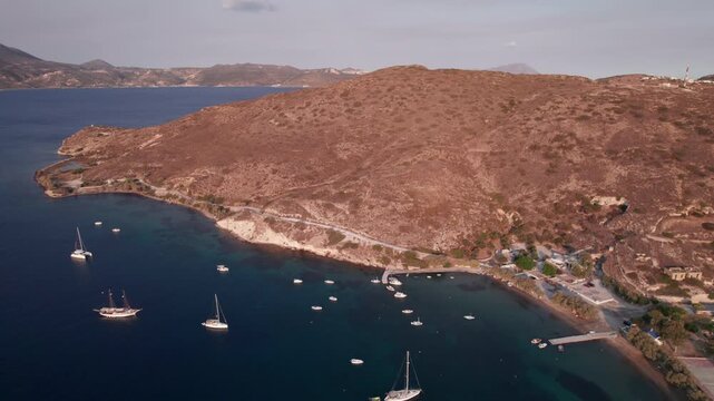 View of a secluded bay with sailboats in Parikia, Paros Island, Greece captured from above