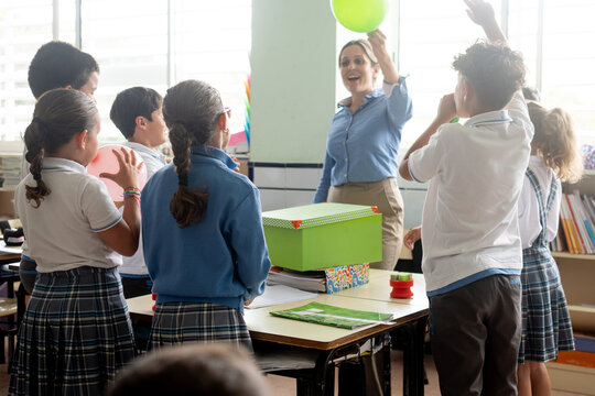 Elementary school teacher leading a classroom science experiment