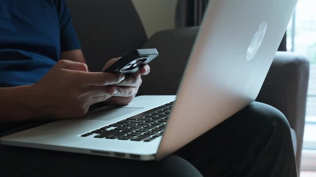 Close up of male hands typing on laptop computer keyboard for remote work or coding