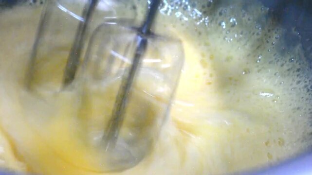 Whisking Eggs to Prepare Homemade Cake Batter for a Tart