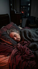 Fototapeta premium Elderly Person Sleeping Peacefully In A Cozy Bedroom At Night