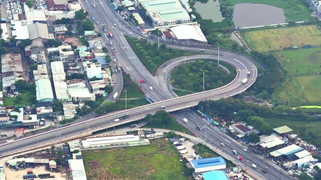 Aerial view of Binh Tan District, Ho Chi Minh City, Vietnam, showing dense urban development, residential neighborhoods, industrial zones, and the connection to the Ho Chi Minh City&ndash;Trung Luong Expres