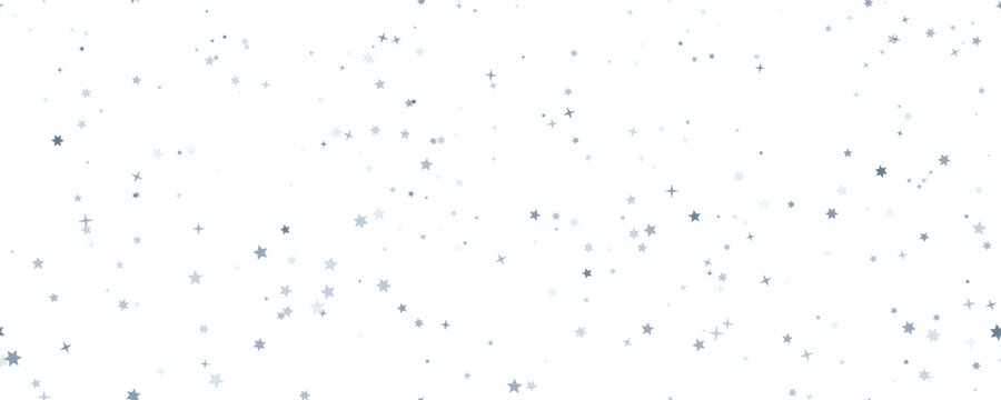 Subtle starbursts and speckles in soft ambient light with a shallow depth of field for celebration backgrounds