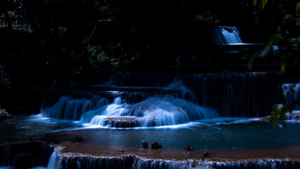 Cascading Tiered Waterfall Flowing Through Deep Tropical Forest At Night At Huai Mae Khamin Waterfall In Kanchanaburi Thailand © SHUTTER DIN