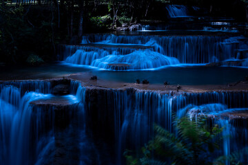 Cascading Tiered Waterfall Flows Over Limestone Terraces At Huai Mae Khamin Waterfall In Kanchanaburi Thailand Captured In A Stunning Long Exposure Nocturnal Scene © SHUTTER DIN