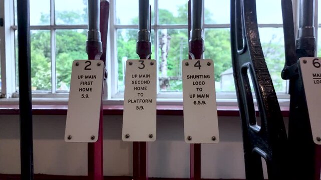 Old railway signal box with a row of mechanical levers for operating signals and points