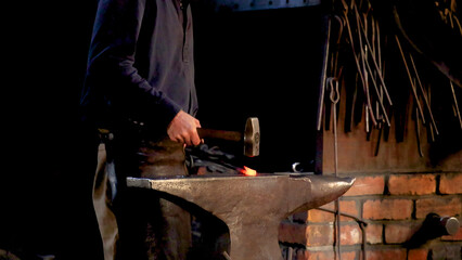 Blacksmith Hammering Glowing Hot Metal on an Anvil in Ballarat Workshop © blueringmedia