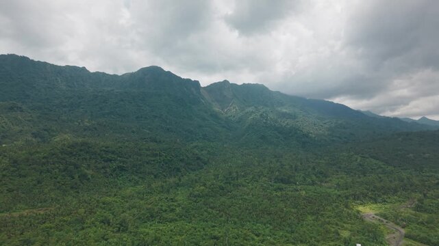 Tropical Lush Green Landscape With Guinsaugon Landslide Mountain In The Background In Saint Bernard, Southern Leyte, Philippines. Aerial Wide Shot