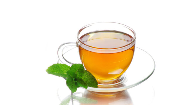 tea in cup with leaf mint isolated on white background