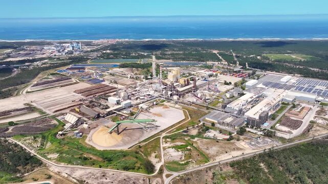 Aerial view of a pulp and paper mill near the ocean coast