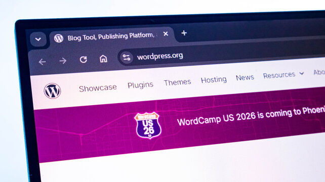 WordPress website homepage showing on laptop screen with browser tabs and navigation menu.