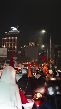 Vietnamese soccer fans celebrating victory at night