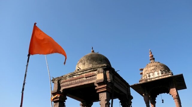 A saffron flag flying on the premises of Bhojeshwar Temple, an ancient incomplete temple in Bhojpur, Madhya Pradesh, India