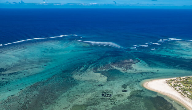 Aerial view of beautiful turquoise coral reef lagoon and white sand beach, tropical island landscape background