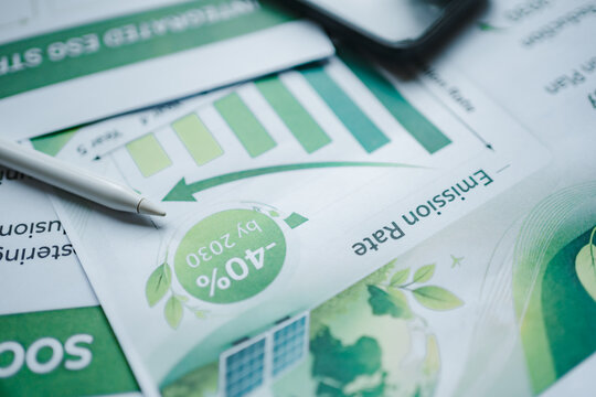 ESG report emission rate carbon reduction sustainability targets net zero 2030 corporate metrics, close up of stylus smartphone on environmental chart analyzing green business strategy climate action