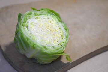 Fototapeta premium Cabbage on a chopping board. Vegetarian food. Healthy raw food