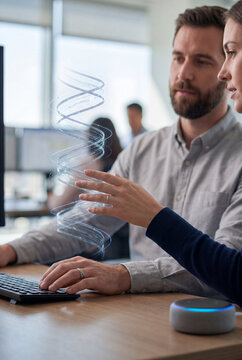 Business colleagues examining digital data visualization at computer workstation