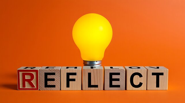 Reflect concept with glowing light bulb on wooden blocks symbolizing self awareness and personal growth