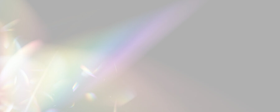 PNG. Rainbow crystal shine with radiant optical highlights. Soft colorful rays spread through the scene. Transparent bokeh creates a magical atmosphere.