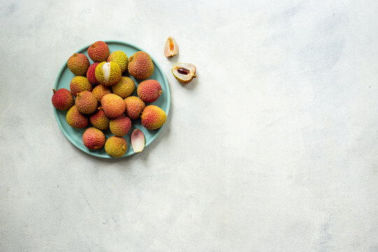 Plate of exotic lychee fruit, top view. Healthy vegetarian meal ready to eat