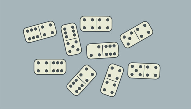Group of white domino tiles with black dots scattered on gray background