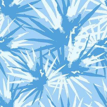 Seamless abstract pattern of light blue palm leaves on a matching light blue background with seamless tropical botanical background