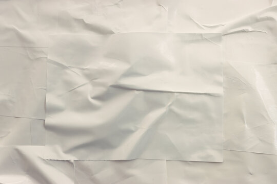 Background of white textured paper with crumples. Poster or sticker with pattern
