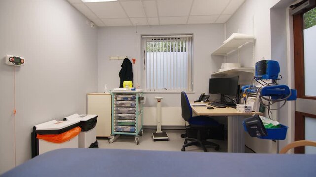 Clean and sterile doctor's examination room with medical equipment and supplies.