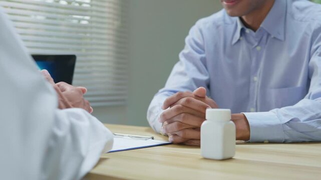 Doctor explaining treatment and medication instructions to a patient online through a laptop during a telehealth consultation, representing digital healthcare, prescription guidance, remote medical ad