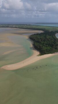 Nishihama Beach And Forested Peninsula In Miyakojima, Okinawa, Japan. - aerial vertical shot