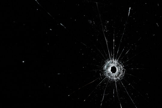 Bullet holes on black glass, overlay design background