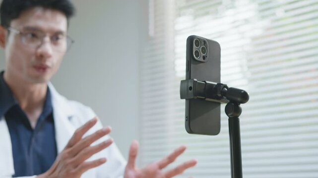 Doctor explaining treatment and medication instructions to a patient online through a smartphone during a telehealth consultation, representing remote healthcare, digital medical advice, prescription 