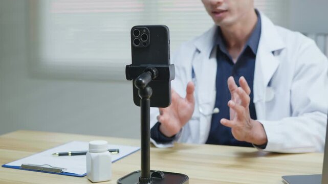 Doctor explaining treatment and medication instructions to a patient online through a smartphone during a telehealth consultation, representing remote healthcare, digital medical advice, prescription 