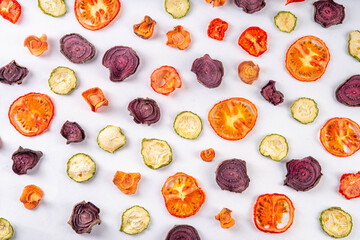 Fototapeta na wymiar Healthy alternative for traditional potato chips, snack air fried vegetables chips, raw organic dehydrated veggies - beets, carrots, zucchini, kale, tomatoes, 