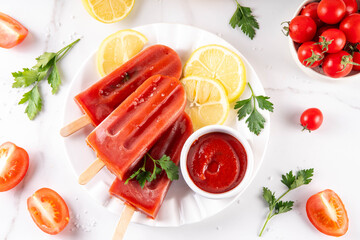 Ketchup ice cream lollies, spice tomato popsicles on sticks.  Vegetable tomato iced frozen gelato dessert, healthy low calorie and vegan diet unusual sorbet dessert © ricka_kinamoto