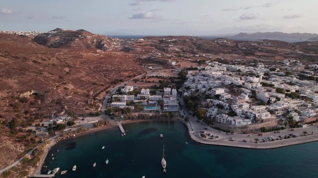 Drone view of secluded bay with sailboats near Parikia on Paros Island in Greece