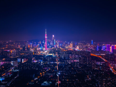 Stunning aerial night view of Guangzhou cityscape illuminated by vibrant neon lights, future of China