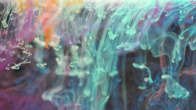 A  captivating and hypnotic visualization of colorful ink slowly dissolving in water. A blend of vibrant pastel hues&mdash;such as turquoise, pink, purple, orange, and yellow.