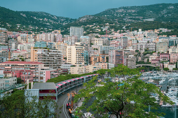Obraz premium Exclusive real estate development and luxury hillside residential apartments overlooking Port Hercules in Monte Carlo, Monaco