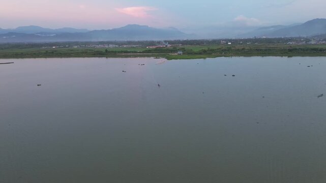 Aerial View of Fishing Boat on a Calm Lake at Dusk