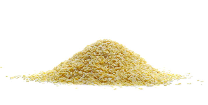 Corn flakes pile isolated on white background, side view