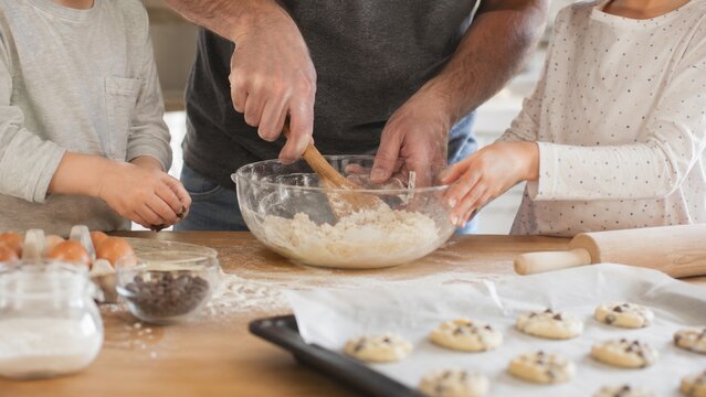 A Family Baking Together: Creating Delicious Cookies with Love, Flour, and Fun in the Kitchen