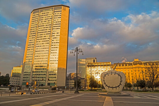 MILAN, ITALY - DECEMBER 11, 2016: The monumental sculpture ,,The Reintegrated Apple" by Michelangelo Pistoletto, in front of Milan's central railway station, in morning light.