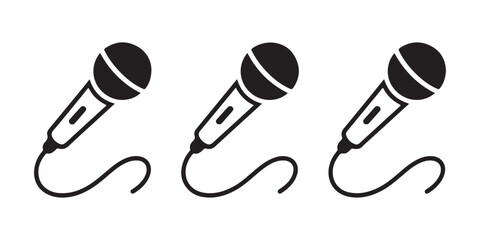 Three handheld microphone vector icons with cables in black, on transparent background. © StockDesign