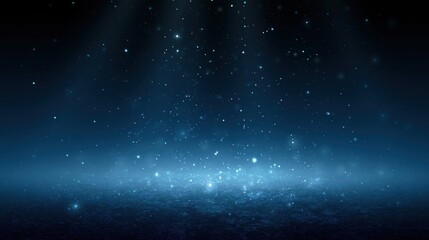 Fototapeta premium Abstract blue glowing particles falling over dark textured surface