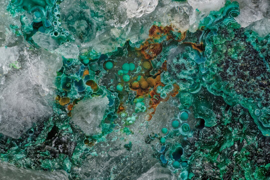 Green malachite spherulites with raw white quartz documentary scientific microphotography, mineral surface texture captured through microscope lens magnification, abstract geological background