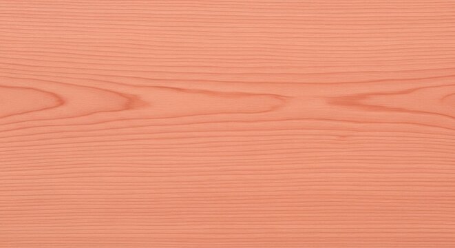 Minimalist soft pastel salmon colored wood surface featuring fine linear grain texture for modern aesthetic interior designs.