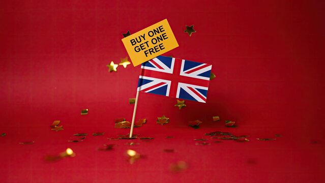 Promotional buy one get one free sale sign with union jack flag on red background