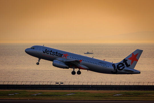 A Jetstar Japan Airbus A320 taking off at sunset on April 19, 2025 in Japan.